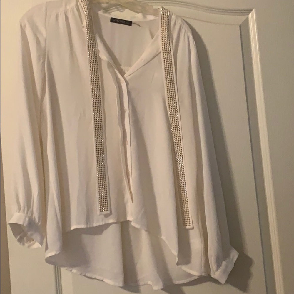 White blouse with gold detail